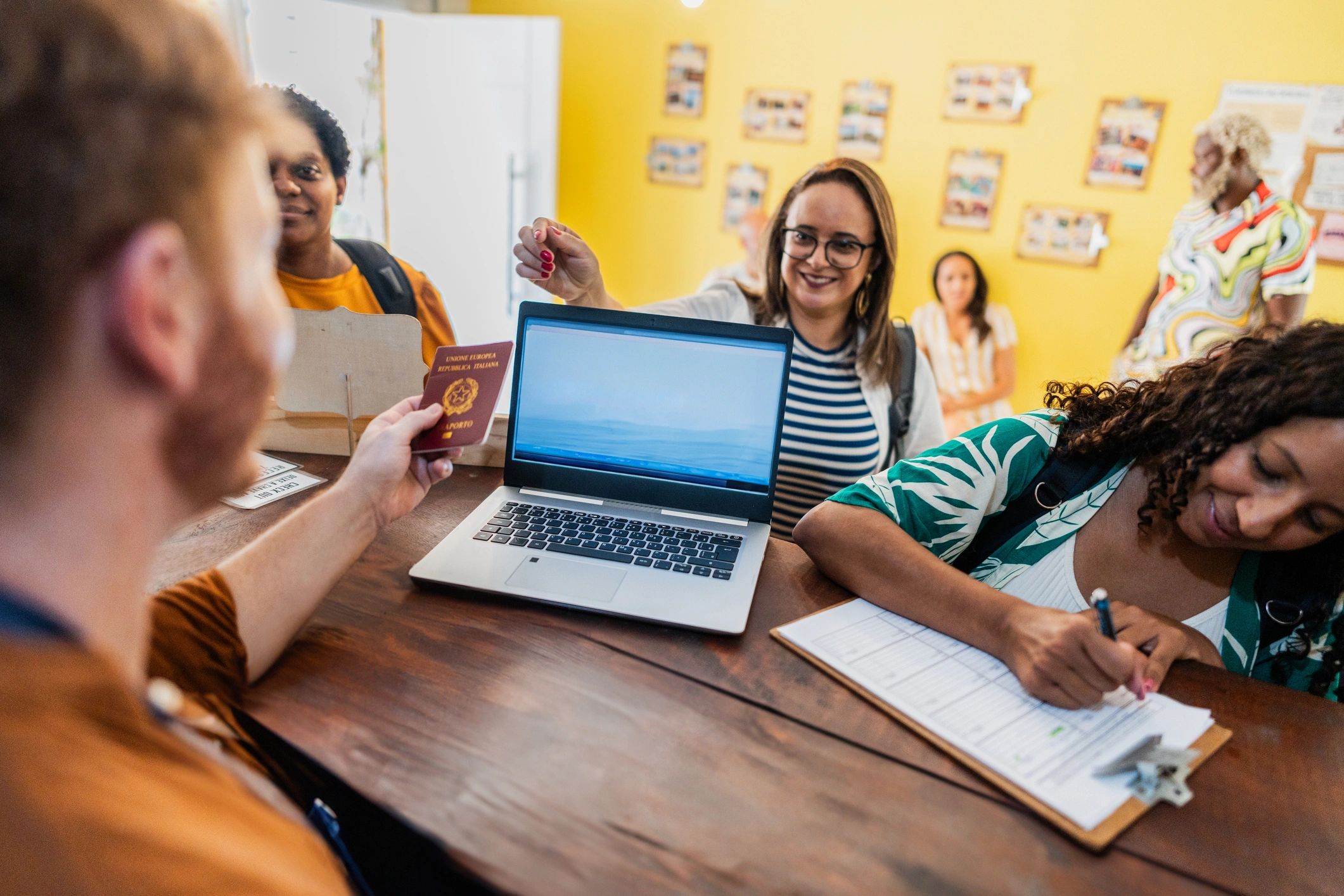 Travelers checking in at a hotel reception