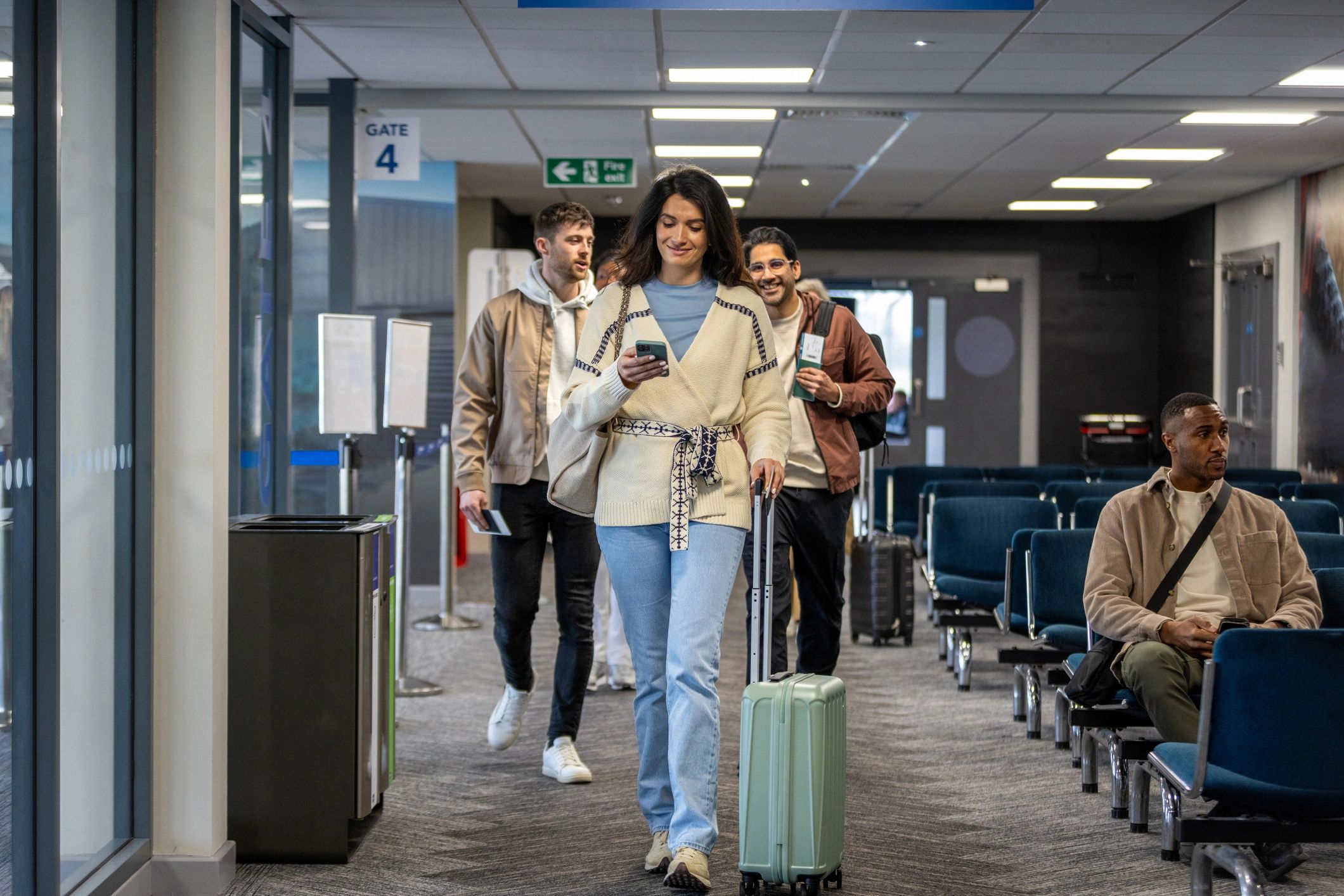 Travelers walking through an airport terminal